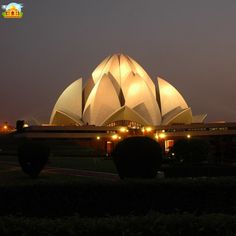 a large white building lit up at night