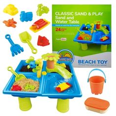 the plastic sand and water table is set up with toys