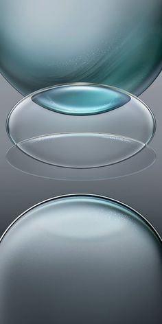 an image of some glass objects that are in the shape of circles and ovals