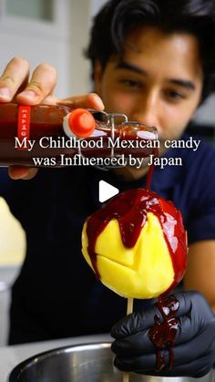 a man is pouring sauce on a candy apple with the caption my childhood mexican candy was influenced by japan