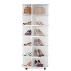 a white shelf with several pairs of shoes on it