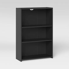 a black bookcase with three shelves on each side