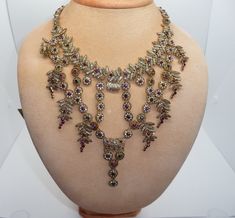 Stunning Vintage Statement Bib / Fringe Necklace by Zara Edwardian revival design Made from gold tone metal and featuring a cascade of flowers and leaves smothered in multi colour crystals The drop to the middle measures approx. 5 inches with the necklace measuring approx. 19 1/2 inches long to the end of the extender which can be used to shorten the necklace for that perfect fit Zara tag is attached to the end of the chain An absolutely fabulous runway statement necklace in great condition - a rare and hard to find piece of Zara jewellery