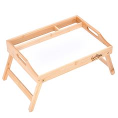 a wooden tray with writing on it