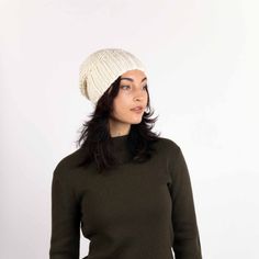 A staff favorite at Pistil, and a best seller, the Juliette is a beautiful little hand-knit slouchy that goes with everything and is divinely comfortable. Made of an acrylic yarn that's so soft, the hat doesn't need a liner, the knit transitions from extra-wide ribs to gently nubby in the crown. The faux fur pom topper is dyed to match. If you're in the mood, fold the edge up to create a classic watch cap. Fold the edge up to create a classic watch cap. Matching faux fur pom Acrylic Hand wash in Beige One Size Beanie Hat, Beige Beanie Hat One Size, One Size Beige Beanie Hat, Beige Crochet Beanie Hat, One Size Fits Most, Beige Crochet Beanie Hat, Cozy Knit Fitted Hats, Beige Crochet Beanie Hat One Size, Beige Soft Knit Hat One Size, Cozy Beige Crochet Hat