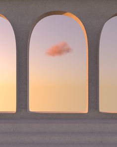 an orange cloud is in the sky through three arched windows with arches on either side