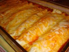 a casserole dish filled with cheese and meat