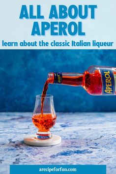 a bottle of alcohol being poured into a wine glass with the caption, all about aperol learn about the classic italian liquor