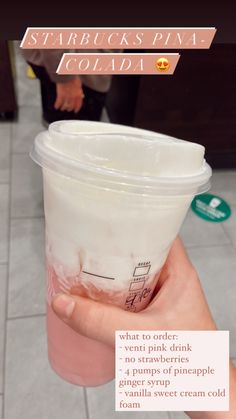 a person holding up a plastic cup with pink liquid in it's hand and the caption reads starbuckss plaza colladi what to order