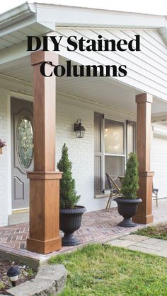 two large planters are on the front porch