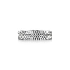 Streamlined and modern, the Tiffany Metro collection twinkles like a nighttime city skyline. Five rows of dazzling diamonds make this ring a stunning statement piece. 18k white gold with round brilliant diamonds; Carat total weight .94; Our 18k white gold is plated with rhodium to maintain its brilliance | Tiffany Metro Five-Row Ring in 18k White Gold with Diamonds, Size: 7 Tiffany Stackable Rings, Nighttime City, Tiffany Diamond Ring, Tiffany Ring, Tiffany Rings, Forever Rings, Vintage Tiffany, Engraved Items, City Skyline