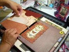 a woman is cutting fabric with scissors on a table