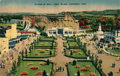 an old postcard shows people walking around the park