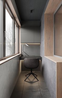 a chair sitting next to a window in a room