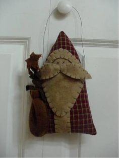 a stuffed animal hanging from the side of a door