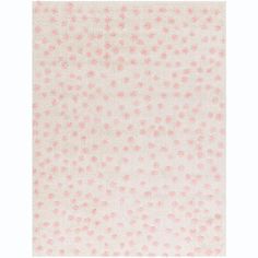 a white rug with pink dots on it