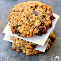 an oatmeal cookie is stacked on top of each other with chocolate chips