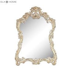 an ornate white mirror with gold trimmings on the edges and a decorative frame