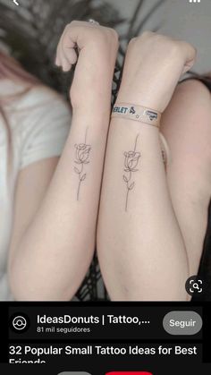 two girls with tattoos on their arms and one has a rose tattoo on her arm