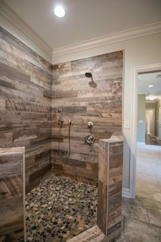 a walk in shower sitting inside of a bathroom