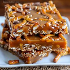 two pieces of chocolate caramel pretzel bars stacked on top of each other