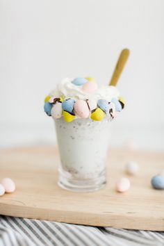 an ice cream sundae topped with marshmallows and candy