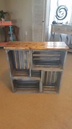 a wooden table sitting on top of a carpeted floor