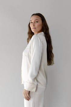 Feel the luxury with our Silk Long Sleeve Pajama Top as it glides over your skin effortlessly. Treated with aloe vera and made from 100% mulberry silk, this top is lightweight, soothing, and loose-fitting. Featuring a chest pocket, elegant mulberry silk flat piping, inner French seams, logo engraved shell buttons, and an eco-friendly plated logo charm. Pair with our women's silk pajama shorts or women's silk pajama pants for the ultimate silk sleep set. DETAILS: 100% mulberry silk Women's Sereni Silk Pajama Shorts, Silk Pajamas Shorts, Silk Pajama Pants, Silk Pajamas Women, Classic Pajamas, Nighttime Routine, Silk Pajama, Pajama Pant, Hot Flashes