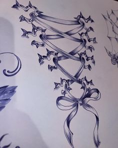 a drawing of stars and ribbons on paper