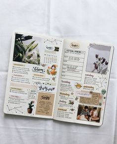 an open planner book with pictures and words on the pages, sitting on top of a white sheet