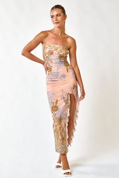 This stylish tube maxi dress offers a beautiful floral pattern adorned with ruffles and a front slit for a gorgeous look. Its versatility is perfect for any occasion — take it on your upscale vacations, to the garden party, or on your romantic date night in Paris and enjoy the elegance of this captivating design. Sleeveless Tube Maxi Dress Side Slit with ruffle detailing Peach + Gold Multicolor Fully Lined Self: 95% Polyester + 5% Spandex Lining: 100% Polyester Date Night In Paris, Newport Rhode Island Wedding, Tube Maxi Dress, Loungewear Summer, Night In Paris, Tube Maxi Dresses, Romantic Date Night, Date Night In, Maxi Dress Pattern