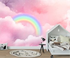 a bedroom with a rainbow mural on the wall