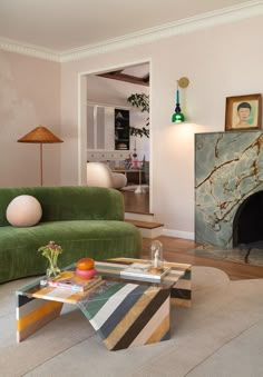 a living room filled with furniture and a green couch