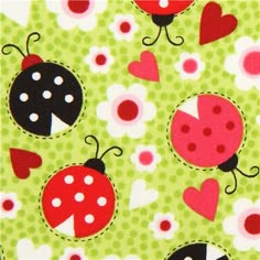 ladybugs and hearts on green fabric