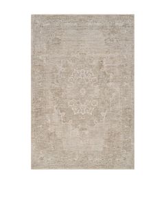 a beige rug with an intricate design on the top and bottom, in front of a white background