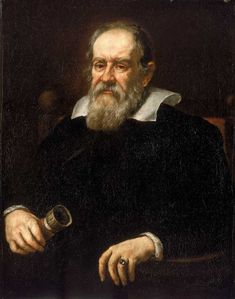 an old man with a long beard and wearing a black coat is holding a glass in his hand