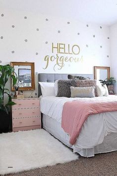 a bedroom with polka dot wall decals on the walls and a bed in it