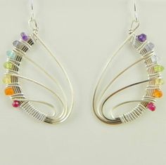 the earrings are made with silver wire and colorful stones