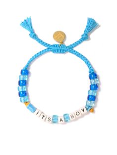 Celebrate the arrival of your little one with our It's A Boy Bracelet! Adorned with blue threadwork, a pacifier charm, and a baby bottle charm, this bracelet is the perfect (and eco-friendly) way to reveal your baby's gender. Show off your excitement with this fun and playful accessory. 6" Adjustable blue threadwork Drawstring closure (extendable up to 8") Gold plated brass hardware Glass charms Ceramic charms Handmade in New York City and Puerto Rico. Due to the handmade nature of our products, some charms may vary in color and style or be replaced if unavailable. Please allow 5-7 business days for production. Playful Adjustable Blue Charm Bracelet, Hypoallergenic Blue Beaded Bracelets For Birthdays, Hypoallergenic Blue Beaded Bracelets For Birthday, Adjustable Blue Bracelets For Birthday, Adjustable Playful Blue Jewelry, Playful Adjustable Blue Jewelry, Adjustable Hypoallergenic Blue Charm Bracelet, Blue Letter Beads Friendship Bracelet For Birthday, Playful Blue Beaded Bracelets For Birthday