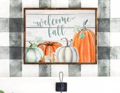 a wooden sign that says welcome fall with pumpkins