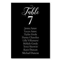 a table number card with black and white lettering