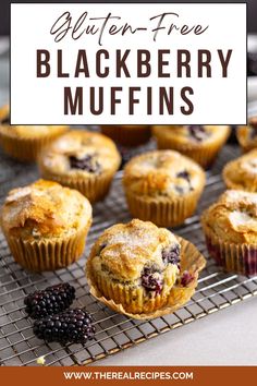 blueberry muffins on a cooling rack with berries and blackberries in the background