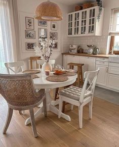 a white table and chairs in a room