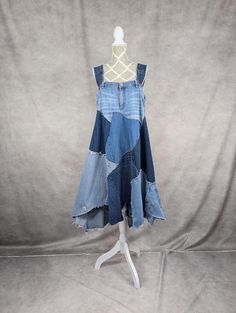 a dress made out of old jeans on a mannequin headdress,