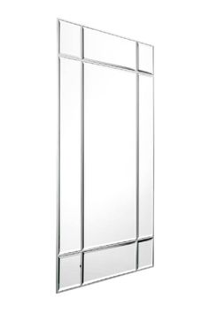 a mirror that is on the side of a wall with four squares in it and one square