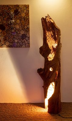 a large piece of wood sitting on top of a wooden floor next to a wall