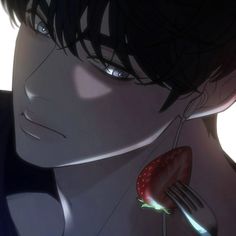 an anime character holding a strawberry in his hand