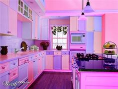 a kitchen with pink and purple cabinets and wood floors