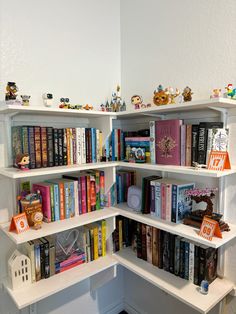 a corner book shelf filled with lots of books