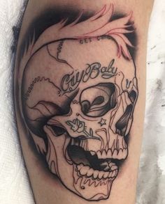 a black and white tattoo with a skull on it